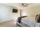 Bedroom with wood floors, bed, and mounted TV at 4333 E Mcdonald Dr, Phoenix, AZ 85018