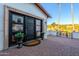 Inviting front entrance with a modern black door, planters, and a brick walkway at 4333 E Mcdonald Dr, Phoenix, AZ 85018