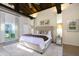 Main bedroom with high ceilings, plush bed, and access to a private patio at 4333 E Mcdonald Dr, Phoenix, AZ 85018