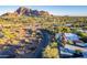 Aerial view showcasing the home's setting and Camelback Mountain at 4333 E Mcdonald Dr, Phoenix, AZ 85018