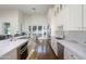 Spacious kitchen with white cabinets, marble countertops, and high-end appliances at 4333 E Mcdonald Dr, Phoenix, AZ 85018