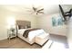 Bedroom with wood floors, plush bed, and window at 4333 E Mcdonald Dr, Phoenix, AZ 85018