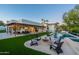 Outdoor fire pit and seating area adjacent to a refreshing pool at 4333 E Mcdonald Dr, Phoenix, AZ 85018