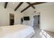 Bedroom with wood floors, bed, and access to other rooms at 4333 E Mcdonald Dr, Phoenix, AZ 85018
