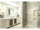 Bathroom with marble shower, vanity, and illuminated mirror at 4333 E Mcdonald Dr, Phoenix, AZ 85018