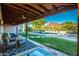 Large backyard pool and patio with covered seating and mountain views at 4333 E Mcdonald Dr, Phoenix, AZ 85018