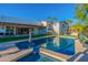 Inviting swimming pool with a large patio and lush landscaping at 4333 E Mcdonald Dr, Phoenix, AZ 85018