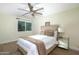 Cozy bedroom with ceiling fan and wood flooring at 4333 E Mcdonald Dr, Phoenix, AZ 85018