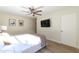 Bright bedroom with large TV and wood flooring at 4333 E Mcdonald Dr, Phoenix, AZ 85018