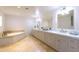 Elegant bathroom with double vanity, soaking tub, and separate shower at 4333 E Mcdonald Dr, Phoenix, AZ 85018