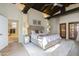 Spacious bedroom with hardwood floors, high ceilings, and ensuite bathroom access at 4333 E Mcdonald Dr, Phoenix, AZ 85018