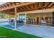 Relaxing patio with covered seating area and view into the living area at 4333 E Mcdonald Dr, Phoenix, AZ 85018