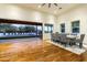 Bright dining area with hardwood floors, sliding doors, and view of the pool at 4333 E Mcdonald Dr, Phoenix, AZ 85018