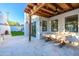 Outdoor patio with wood pergola, stone flooring, and a fireplace at 4333 E Mcdonald Dr, Phoenix, AZ 85018