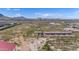 Aerial view of property with horse stables and desert landscape at 14700 S Tuthill Rd, Buckeye, AZ 85326