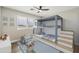 bedroom with built-in bunk bed and playful decor at 14700 S Tuthill Rd, Buckeye, AZ 85326
