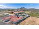 Aerial view of a ranch-style home with a pool and large yard at 14700 S Tuthill Rd, Buckeye, AZ 85326