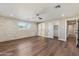 Bright bedroom featuring wood-look floors and ample closet space at 14700 S Tuthill Rd, Buckeye, AZ 85326