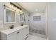 Modern bathroom with marble shower and stylish double vanity at 14700 S Tuthill Rd, Buckeye, AZ 85326