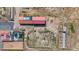 Aerial view showing house, pool, and outbuildings at 14700 S Tuthill Rd, Buckeye, AZ 85326