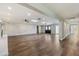 Open living area featuring wood-look floors and recessed lighting at 14700 S Tuthill Rd, Buckeye, AZ 85326
