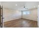Bright bedroom with wood floors and an accent wall at 14700 S Tuthill Rd, Buckeye, AZ 85326