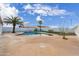 Landscaped backyard with a kidney-shaped pool and plenty of space for relaxation at 14700 S Tuthill Rd, Buckeye, AZ 85326