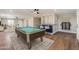 Game room with pool table and bar area at 14700 S Tuthill Rd, Buckeye, AZ 85326