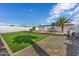 Large backyard with artificial turf, gravel, and a sparkling pool at 14700 S Tuthill Rd, Buckeye, AZ 85326