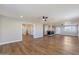 Open living space with wood floors and high ceilings at 14700 S Tuthill Rd, Buckeye, AZ 85326