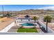 Aerial view showcasing a house, pool, and surrounding landscape at 14700 S Tuthill Rd, Buckeye, AZ 85326