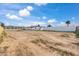 Large vacant lot behind the house, ready for development at 14700 S Tuthill Rd, Buckeye, AZ 85326