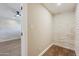 Clean hallway with light walls and wood floors at 14700 S Tuthill Rd, Buckeye, AZ 85326