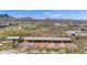 Aerial view of property with horse stables and large yard at 14700 S Tuthill Rd, Buckeye, AZ 85326