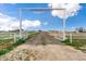 Stardust Ranch entrance with open gates at 14700 S Tuthill Rd, Buckeye, AZ 85326