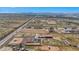 Aerial view showing large lot, home, pool, and surrounding desert landscape at 14700 S Tuthill Rd, Buckeye, AZ 85326