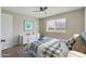 Bedroom with wood-look floors and a dresser at 14700 S Tuthill Rd, Buckeye, AZ 85326