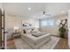 Spacious bedroom with wood floors, ceiling fan and large window at 14700 S Tuthill Rd, Buckeye, AZ 85326
