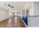 Open living area with wood floors and a breakfast bar at 14700 S Tuthill Rd, Buckeye, AZ 85326