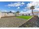 Expansive backyard featuring a pool, artificial turf, and attractive landscaping at 14700 S Tuthill Rd, Buckeye, AZ 85326