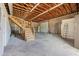 Large workshop featuring high ceilings, a roll-up door, and ample storage at 14700 S Tuthill Rd, Buckeye, AZ 85326