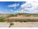 Large, mostly empty pasture with sparse vegetation at 14700 S Tuthill Rd, Buckeye, AZ 85326