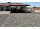Side view of the house highlighting the landscaping and brickwork at 14700 S Tuthill Rd, Buckeye, AZ 85326