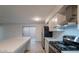 Modern kitchen with white cabinets, quartz countertops, and stainless steel appliances at 2625 E 10Th St, Tempe, AZ 85288
