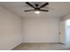 Bright bedroom with ceiling fan and wood-look tile flooring at 2625 E 10Th St, Tempe, AZ 85288