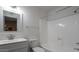 Updated bathroom with white vanity, bathtub, and shower at 2625 E 10Th St, Tempe, AZ 85288