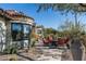 Relaxing patio with seating area and desert plants at 6616 E El Sendero Rd, Carefree, AZ 85377