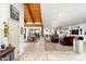 Open living room with hardwood floors, leather sofas, and a fireplace at 6616 E El Sendero Rd, Carefree, AZ 85377