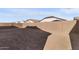 Large backyard with a block wall and unlandscaped area at 682 E Aurora Dr, San Tan Valley, AZ 85140