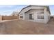 Spacious backyard with covered patio and unlandscaped area at 682 E Aurora Dr, San Tan Valley, AZ 85140